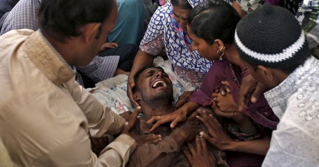 Un pèlerin vient d'apprendre la mort d'un proche à la Mecque, le 25 septembre 2015. Photo: REUTERS/Amit Dave